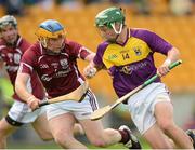 28 July 2012; Conor McDonald, Wexford, in action against Paul Killeen, Galway. Electric Ireland GAA Hurling Minor Championship Quarter-Final, Galway v Wexford, O'Connor Park, Tullamore, Co. Offaly. Photo by Sportsfile