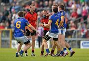 28 July 2012; Paddy Codd, Tipperary, clashes with Brendan Coulter, Down, as Tipperary players Ciarán McDonald, 4, Robbie Kelly, 6 and George Hannigan, right, and Ambrose Rogers, Down, look on. GAA Football All-Ireland Senior Championship Qualifier, Round 4, Down v Tipperary, Cusack Park, Mullingar, Co. Westmeath. Picture credit: Barry Cregg / SPORTSFILE