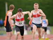 29 July 2012; Darragh Whyte, Galway City Harriers AC, Co. Galway, takes the batton from team mate Anthony Hebron before leading his team to win the Boy's Under-19 4x400m relay. Woodie’s DIY Juvenile Track and Field Championships of Ireland, Tullamore Harriers Stadium, Tullamore, Co. Offaly. Picture credit: Matt Browne / SPORTSFILE