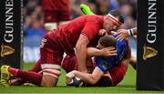 7 October 2017; Rory O'Loughlin of Leinster scores his side's first try despite the efforts of Robin Copeland of Munster during the Guinness PRO14 Round 6 match between Leinster and Munster at the Aviva Stadium in Dublin. Photo by Brendan Moran/Sportsfile