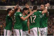 6 October 2017; Daryl Murphy, 8, is congratulated by his Republic of Ireland team-mates, from left, Shane Long, Callum O'Dowda, Stephen Ward and Shane Duffy after scoring their second goal during the FIFA World Cup Qualifier Group D match between Republic of Ireland and Moldova at Aviva Stadium in Dublin. Photo by Stephen McCarthy/Sportsfile