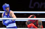 29 July 2012; Adam Nolan, Ireland, left, exchanges punches with Carlos Sanchez Estacio, Ecuador, during their men's welter 69kg round of 32 contest. London 2012 Olympic Games, Boxing, South Arena 2, ExCeL Arena, Royal Victoria Dock, London, England. Picture credit: David Maher / SPORTSFILE