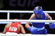 29 July 2012; Adam Nolan, Ireland, right, exchanges punches with Carlos Sanchez Estacio, Ecuador, during their men's welter 69kg round of 32 contest. London 2012 Olympic Games, Boxing, South Arena 2, ExCeL Arena, Royal Victoria Dock, London, England. Picture credit: David Maher / SPORTSFILE