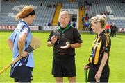 28 July 2012; Referee Alan Lagrue tosses the coin between team captains Elaine O'Meara, Dublin, left, and Catherine Doherty, Kilkenny, before the game. All-Ireland Senior Camogie Championship, Quarter-Final Qualifier, Dublin v Kilkenny, O'Moore Park, Portlaoise, Co. Laois. Picture credit: Pat Murphy / SPORTSFILE