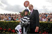 30 July 2012; Jockey Jane Mangan in the parade ring with trainer Dermot Weld after winning the Carlton Hotel Galway City Handicap on Midnight Magic. Galway Racing Festival 2012, Ballybrit, Galway. Picture credit: Barry Cregg / SPORTSFILE