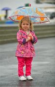 31 July 2012; Ava Connolly, age 3, from Rosscahill, Co. Galway, braves the wet conditions ahead of the day's racing. Galway Racing Festival 2012, Ballybrit, Galway. Picture credit: Barry Cregg / SPORTSFILE