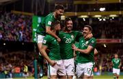 6 October 2017; Daryl Murphy is congratulated by his Republic of Ireland team-mates, from left, Shane Long, Shane Duffy and Stephen Ward after scoring his side's opening goal during the FIFA World Cup Qualifier Group D match between Republic of Ireland and Moldova at Aviva Stadium in Dublin. Photo by Stephen McCarthy/Sportsfile