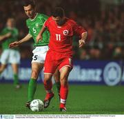16 October 2002; Stephane Chapuisat, Switzerland, in action against the Republic of Ireland's Gary Breen. Republic of Ireland v Switzerland, European Championships 2004 Qualifier, Lansdowne Road, Dublin. Soccer. Picture credit; Brendan Moran / SPORTSFILE