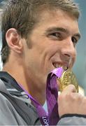 2 August 2012; USA's Michael Phelps with his gold medal after winning the Men's 200m Individual Medley Final. London 2012 Olympic Games, Swimming, Aquatic Centre, Olympic Park, Stratford, London, England. Picture credit: Brendan Moran / SPORTSFILE