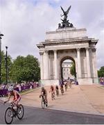 4 August 2012; General view as athlete's compete in the cycling discipline of the women's triathlon final as they pass under the Wellington Arch, at Hyde Park Corner. London 2012 Olympic Games, Triathlon, Hyde Park, London, England. Picture credit: David Maher / SPORTSFILE