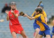 4 August 2012; Sile Burns, Cork, in action against Carol O'Leary, front, and Marie McGrath, Clare. All-Ireland Senior Camogie Championship Quarter-Final, Cork v Clare, Páirc Ui Chaoimh, Cork. Picture credit: Pat Murphy / SPORTSFILE
