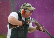 5 August 2012; Ireland's Derek Burnett blows down the barrell of his gun during the men's trap shooting qualification. London 2012 Olympic Games, Shooting, The Royal Artillery Barracks, Greenwich, London, England. Picture credit: Stephen McCarthy / SPORTSFILE