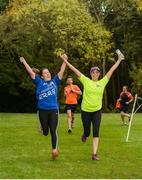 14 October 2017; Friends Orla Scahill, left, from Swords, Dublin, and Emer Molloy, from Portmarnock, Co Dublin, finish the Malahide parkrun where Vhi ambassador and Olympian David Gillick also took part as Vhi hosted a special event to celebrate their partnership with parkrun Ireland. David was on hand to lead the warm up for parkrun participants before completing the 5km course alongside newcomers and seasoned parkrunners alike. Vhi provided walkers, joggers, runners and volunteers at Malahide parkrun with a variety of refreshments in the Vhi Relaxation Area at the finish line. A qualified physiotherapist was also available to guide participants through a post event stretching routine to ease those aching muscles. parkruns take place over a 5km course weekly, are free to enter and are open to all ages and abilities, providing a fun and safe environment to enjoy exercise. To register for a parkrun near you visit www.parkrun.ie. New registrants should select their chosen event as their home location. You will then receive a personal barcode which acts as your free entry to any parkrun event worldwide. Photo by Cody Glenn/Sportsfile