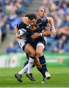 14 October 2017; Robbie Henshaw of Leinster is tackled by Ruan Pienaar of Montpellier during the European Rugby Champions Cup Pool 3 Round 1 match between Leinster and Montpellier at the RDS Arena in Dublin. Photo by Ramsey Cardy/Sportsfile