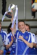 6 August 2012; Roisin Looney, Clare, lifts the cup. Both teams wore provincial colours due to a colour clash, Clare, blue, and Roscommon, white. All-Ireland Ladies Football Minor B Championship Final, Clare v Roscommon, St. Brendan’s Park, Birr, Co. Offaly. Picture credit: Pat Murphy / SPORTSFILE