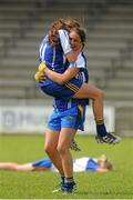 6 August 2012; Clare players Roisin Howley and Niki Kaiser, right, celebrate at the final whistle. Both teams wore provincial colours due to a colour clash, Clare, blue, and Roscommon, white. All-Ireland Ladies Football Minor B Championship Final, Clare v Roscommon, St. Brendan’s Park, Birr, Co. Offaly. Picture credit: Pat Murphy / SPORTSFILE