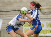 6 August 2012; Aoife O'Gorman, Clare, in action against Rebecca Coyle, Roscommon. Both teams wore provincial colours due to a colour clash, Clare, blue, and Roscommon, white. RoscAll-Ireland Ladies Football Minor B Championship Final, Clare v Roscommon, St. Brendan’s Park, Birr, Co. Offaly. Picture credit: Pat Murphy / SPORTSFILE