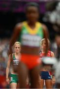 7 August 2012; Ireland's Fionnuala Britton and Norway's Karoline Bjerkeli Grovdal are seen through the arms of eventual winner Tirunesh Dibaba, Ethiopia, before their heat of the women's 5,000m where Britton finished in 10th place but failed to qualify for the final. London 2012 Olympic Games, Athletics, Olympic Stadium, Olympic Park, Stratford, London, England. Picture credit: Brendan Moran / SPORTSFILE