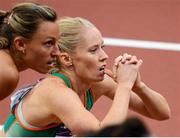 7 August 2012; Ireland's Derval O’Rourke and Eline Berings, Belgium, anxiously watch the stadium scoreboard for their times after their semi-final of the women's 100m hurdles where O'Rourke finished 5th but did not qualify for the final. London 2012 Olympic Games, Athletics, Olympic Stadium, Olympic Park, Stratford, London, England. Picture credit: Brendan Moran / SPORTSFILE