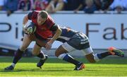 15 October 2017; Keith Earls of Munster is tackled by Afusipa Taumoepeau of Castres Olympique during the European Rugby Champions Cup Pool 4 Round 1 match between Castres Olympique and Munster at Stade Pierre Antoine in Castres, France. Photo by Brendan Moran/Sportsfile