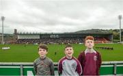 15 October 2017; Slaughtneil supporters, from left, James Kearney, age 12, Eoin Mulholland, age 13, and Darragh Mulholland, age 14, during the national anthem prior to the AIB Ulster GAA Football Senior Club Championship First Round match between Kilcoo and Slaughtneil at Páirc Esler in Down. Photo by Seb Daly/Sportsfile