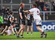 15 October 2017; Niall McEvoy of Kilcoo and Francis McEldowney of Slaughtneil tussle off the ball during the AIB Ulster GAA Football Senior Club Championship First Round match between Kilcoo and Slaughtneil at Páirc Esler in Down. Photo by Seb Daly/Sportsfile