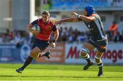15 October 2017; Ian Keatley of Munster races clear of Christophe Samson of Castres Olympique during the European Rugby Champions Cup Pool 4 Round 1 match between Castres Olympique and Munster at Stade Pierre Antoine in Castres, France. Photo by Brendan Moran/Sportsfile