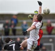 15 October 2017; Patsy Bradley of Slaughtneil out jumps goalkeeper Stephen Kane of Kilcoo to score his side's goal during the AIB Ulster GAA Football Senior Club Championship First Round match between Kilcoo and Slaughtneil at Páirc Esler in Down. Photo by Seb Daly/Sportsfile