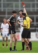 15 October 2017; Eugene Branagan of Kilcoo, left, is shown a red card by referee Niall Cullen during the AIB Ulster GAA Football Senior Club Championship First Round match between Kilcoo and Slaughtneil at Páirc Esler in Down. Photo by Seb Daly/Sportsfile