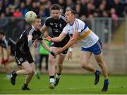 15 October 2017; Ciaran Quinn of Errigal Ciaran in action against Cormac O'Neill, left, and Conor Clarke of Omagh St Enda's during the Tyrone County Senior Football Championship Final match between Errigal Ciaran and Omagh St Enda's at Healy Park in Tyrone. Photo by Oliver McVeigh/Sportsfile