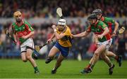 15 October 2017; Gavin Whyte of Sixmilebridge in action against Conor Harrison, 6, and Padraig Ward, left, of Clooney Quin, during the Clare County Senior Hurling Championship Final match between Clooney Quin and Sixmilebridge at Cusack Park in Ennis County Clare. Photo by Ray McManus/Sportsfile