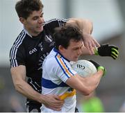 15 October 2017;  Aidan McCrory of Errigal Ciaran in action against Conon Grugan of Omagh St Enda's during the Tyrone County Senior Football Championship Final match between Errigal Ciaran and Omagh St Enda's at Healy Park in Tyrone. Photo by Oliver McVeigh/Sportsfile
