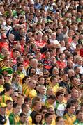 5 August 2012; Supporters of both teams, in the Cusack Stand, stand and sing the National Anthem. GAA Football All-Ireland Senior Championship Quarter-Final, Donegal v Kerry, Croke Park, Dublin. Picture credit: Ray McManus / SPORTSFILE