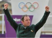 8 August 2012; Ireland's Cian O'Connor celebrates on the podium before receiving his bronze medal after a jump off in the individual show jumping final. London 2012 Olympic Games, Equestrian, Greenwich Park, Greenwich, London, England. Picture credit: Brendan Moran / SPORTSFILE