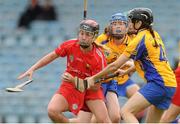 4 August 2012; Sile Burns, Cork, in action against Carol O'Leary and Maire McGrath, back, Clare. All-Ireland Senior Camogie Championship Quarter-Final, Cork v Clare, Páirc Ui Chaoimh, Cork. Picture credit: Pat Murphy / SPORTSFILE