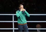 9 August 2012;  Katie Taylor, Ireland, celebrates after winning the gold medal in the women's light 60kg. London 2012 Olympic Games, Boxing, South Arena 2, ExCeL Arena, Royal Victoria Dock, London, England. Picture credit: Stephen McCarthy / SPORTSFILE