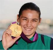 9 August 2012; Katie Taylor, Ireland, celebrates with her gold medal after victory over Sofya Ochigava, Russia, in their women's light 60kg final contest. London 2012 Olympic Games, Boxing, South Arena 2, ExCeL Arena, Royal Victoria Dock, London, England. Picture credit: David Maher / SPORTSFILE