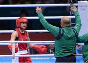 9 August 2012; Katie Taylor, Ireland, is greeted by her father and coach Pete Taylor on her return to her corner following the fourth round with Sofya Ochigava, Russia, in their women's light 60kg final contest. London 2012 Olympic Games, Boxing, South Arena 2, ExCeL Arena, Royal Victoria Dock, London, England. Picture credit: Stephen McCarthy / SPORTSFILE