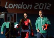 9 August 2012; Katie Taylor, Ireland, accompanied by her coach and father Pete Taylor make their way to the ring ahead of her women's light 60kg final contest with Sofya Ochigava, Russia. London 2012 Olympic Games, Boxing, South Arena 2, ExCeL Arena, Royal Victoria Dock, London, England. Picture credit: Stephen McCarthy / SPORTSFILE