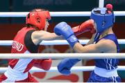 9 August 2012; Katie Taylor, Ireland, exchanges punches with Sofya Ochigava, Russia, during their women's light 60kg final contest. London 2012 Olympic Games, Boxing, South Arena 2, ExCeL Arena, Royal Victoria Dock, London, England. Picture credit: David Maher / SPORTSFILE