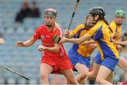 4 August 2012; Sile Burns, Cork, in action against Carol O'Leary and Maire McGrath, back, Clare. All-Ireland Senior Camogie Championship Quarter-Final, Cork v Clare, Páirc Ui Chaoimh, Cork. Picture credit: Pat Murphy / SPORTSFILE