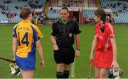 4 August 2012; Referee Karl O'Brien tosses the coin between captains Fiona Lafferty, Clare, left, and Pamela Mackey, Cork, right, before the game. All-Ireland Senior Camogie Championship Quarter-Final, Cork v Clare, Páirc Ui Chaoimh, Cork. Picture credit: Pat Murphy / SPORTSFILE