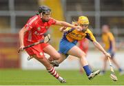 4 August 2012; Gemma O'Connor, Cork, in action against Naomi Carroll, Clare. All-Ireland Senior Camogie Championship Quarter-Final, Cork v Clare, Páirc Ui Chaoimh, Cork. Picture credit: Pat Murphy / SPORTSFILE