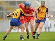 4 August 2012; Eimear O'Sullivan, Cork, in action against Deidre Murphy, 11, and Fiona Lafferty, Clare. All-Ireland Senior Camogie Championship Quarter-Final, Cork v Clare, Páirc Ui Chaoimh, Cork. Picture credit: Pat Murphy / SPORTSFILE