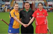4 August 2012; Captains Fiona Lafferty, Clare, left, and Pamela Mackey, Cork, rtight, shake hands in front of referee Karl O'Brien before the game. All-Ireland Senior Camogie Championship Quarter-Final, Cork v Clare, Páirc Ui Chaoimh, Cork. Picture credit: Pat Murphy / SPORTSFILE