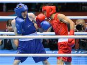 10 August 2012; Paddy Barnes, Ireland, left, exchanges punches with Shiming Zou, China, during their men's light fly 49kg semi-final contest. London 2012 Olympic Games, Boxing, South Arena 2, ExCeL Arena, Royal Victoria Dock, London, England. Picture credit: Stephen McCarthy / SPORTSFILE