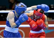 10 August 2012; Paddy Barnes, Ireland, left, exchanges punches with Shiming Zou, China, during their men's light fly 49kg semi-final contest. London 2012 Olympic Games, Boxing, South Arena 2, ExCeL Arena, Royal Victoria Dock, London, England. Picture credit: Stephen McCarthy / SPORTSFILE