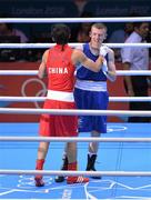 10 August 2012; Paddy Barnes, Ireland, right, congratulates winner Shiming Zou, China, following their men's light fly 49kg semi-final contest. London 2012 Olympic Games, Boxing, South Arena 2, ExCeL Arena, Royal Victoria Dock, London, England. Picture credit: Stephen McCarthy / SPORTSFILE