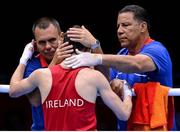 10 August 2012; Michael Conlan, Ireland, is consoled by the corner men of his opposition, after his fly 52kg semi-final contest. London 2012 Olympic Games, Boxing, South Arena 2, ExCeL Arena, Royal Victoria Dock, London, England. Picture credit: Stephen McCarthy / SPORTSFILE