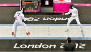 11 August 2012; Ireland's Arthur Lanigan-O’Keeffe duels with Andrei Gheorghe, Guatemala, in round 9 during the fencing discipline of the modern pentathlon. London 2012 Olympic Games, Modern Pentathlon, Copper Box, Olympic Park, Stratford, London, England. Picture credit: Brendan Moran / SPORTSFILE